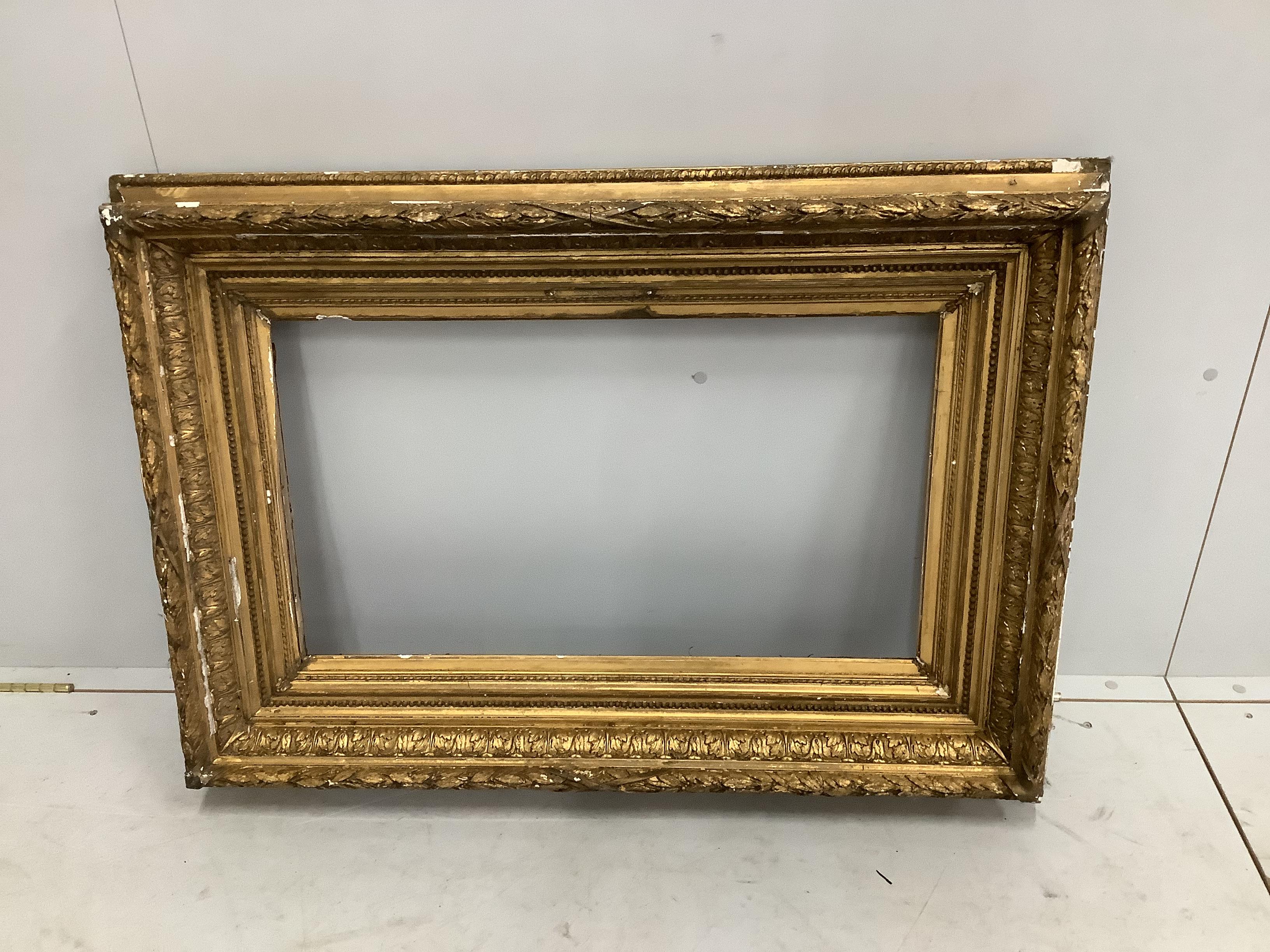 A Victorian rectangular giltwood and composition picture frame, width 73cm, height 105cm